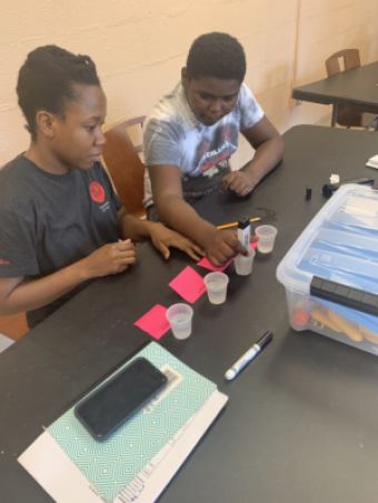 Two students testing water samples