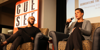 Two panelists speak on-stage at CUESEF 2019